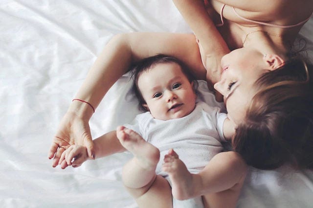 Mum sitting baby asleep