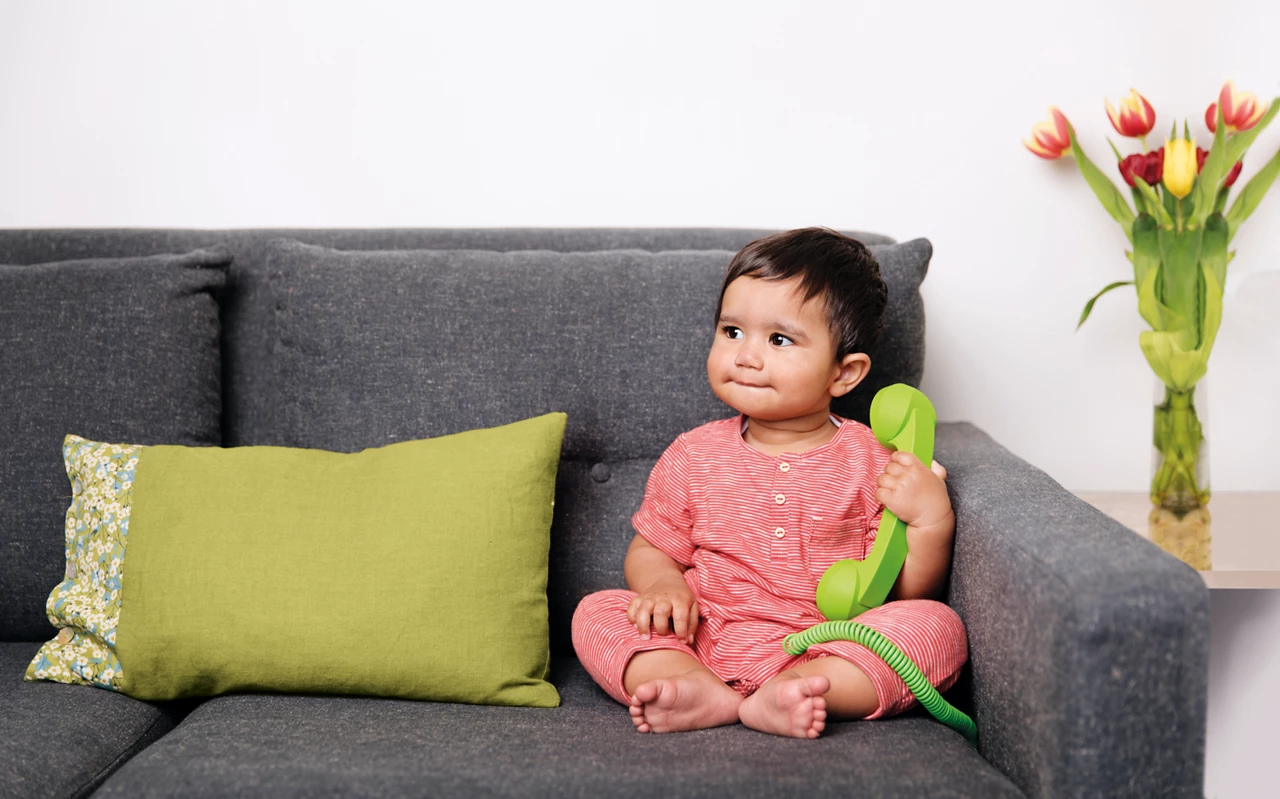 pregnanct couple with baby shoes 