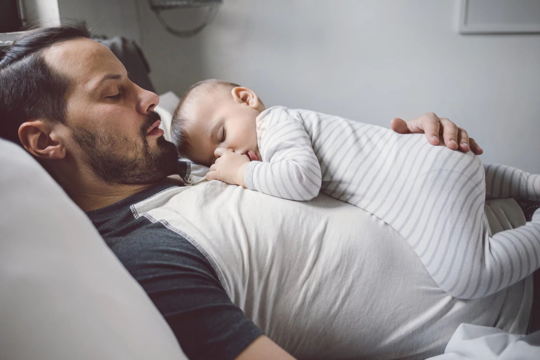 Baby sleeping dad chest